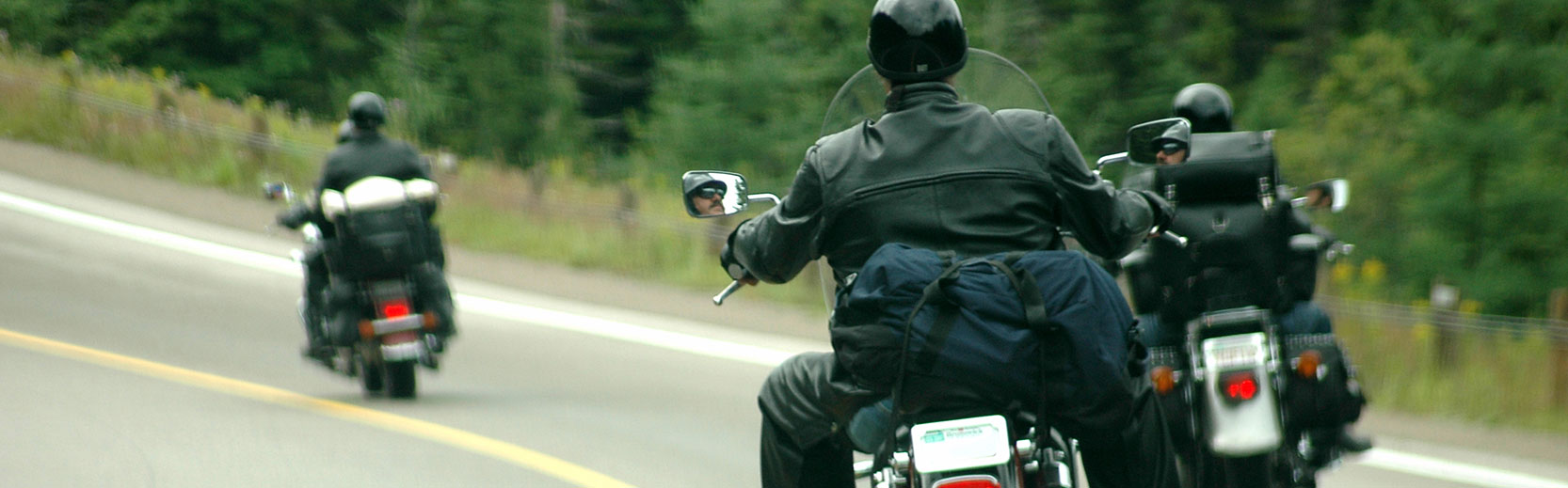 Motorcycle riders using safety precautions when going on a group ride