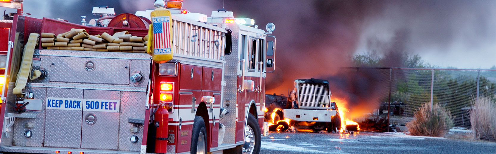truck accident with fire truck and semi truck on fire